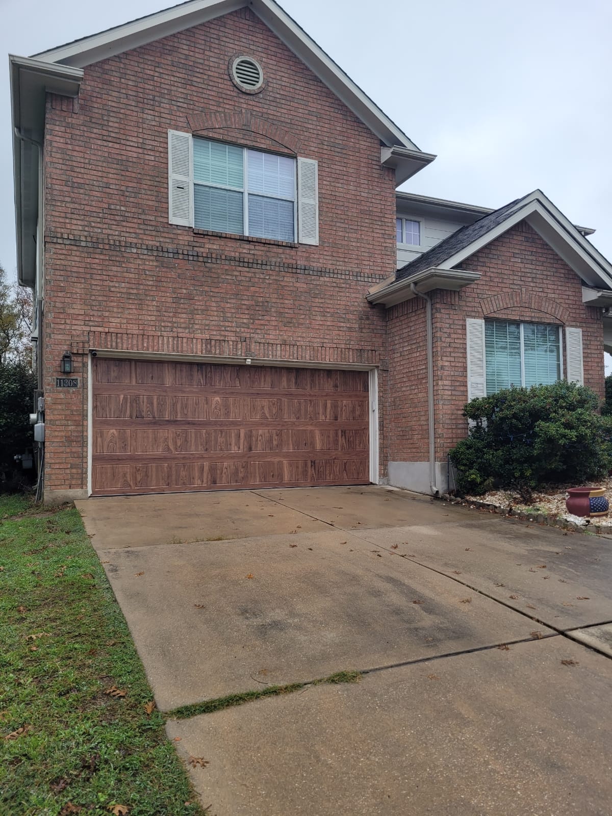 Wood-look composite garage door Cedar Park Austin TX